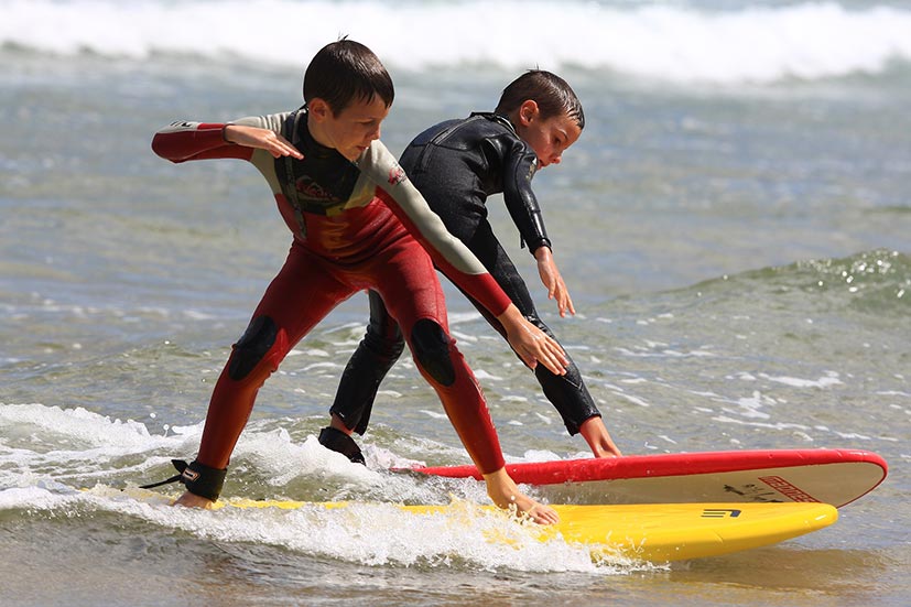 Kids surfing in Cantabria
