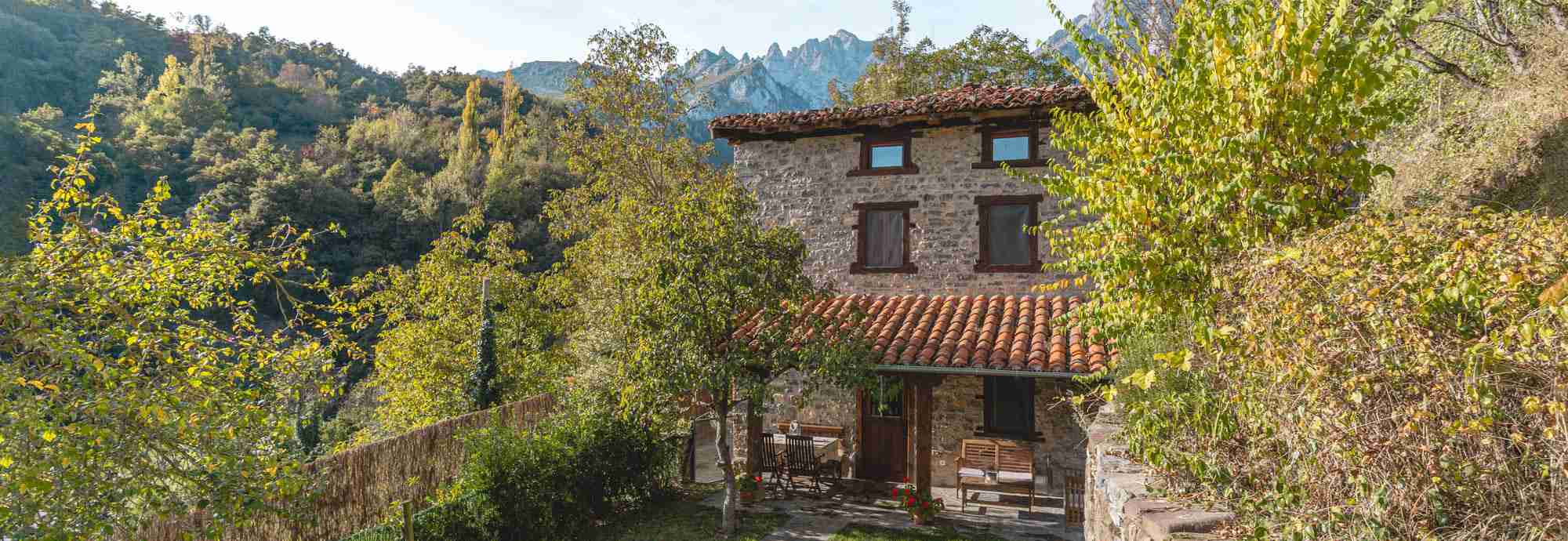 Stone cottage with gardens outside mountain village in Picos de Europa