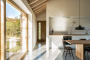 Kitchen / dining with sliding doors opening to gardens