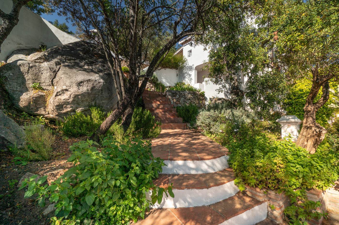 A few steps to more terraces and pool area