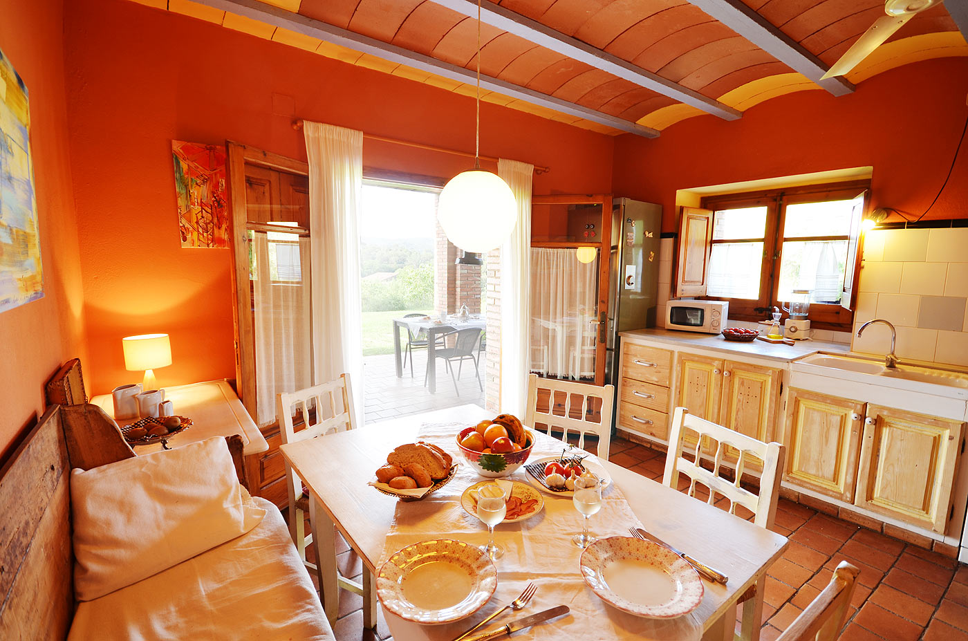 Kitchen with doors opening to gardens