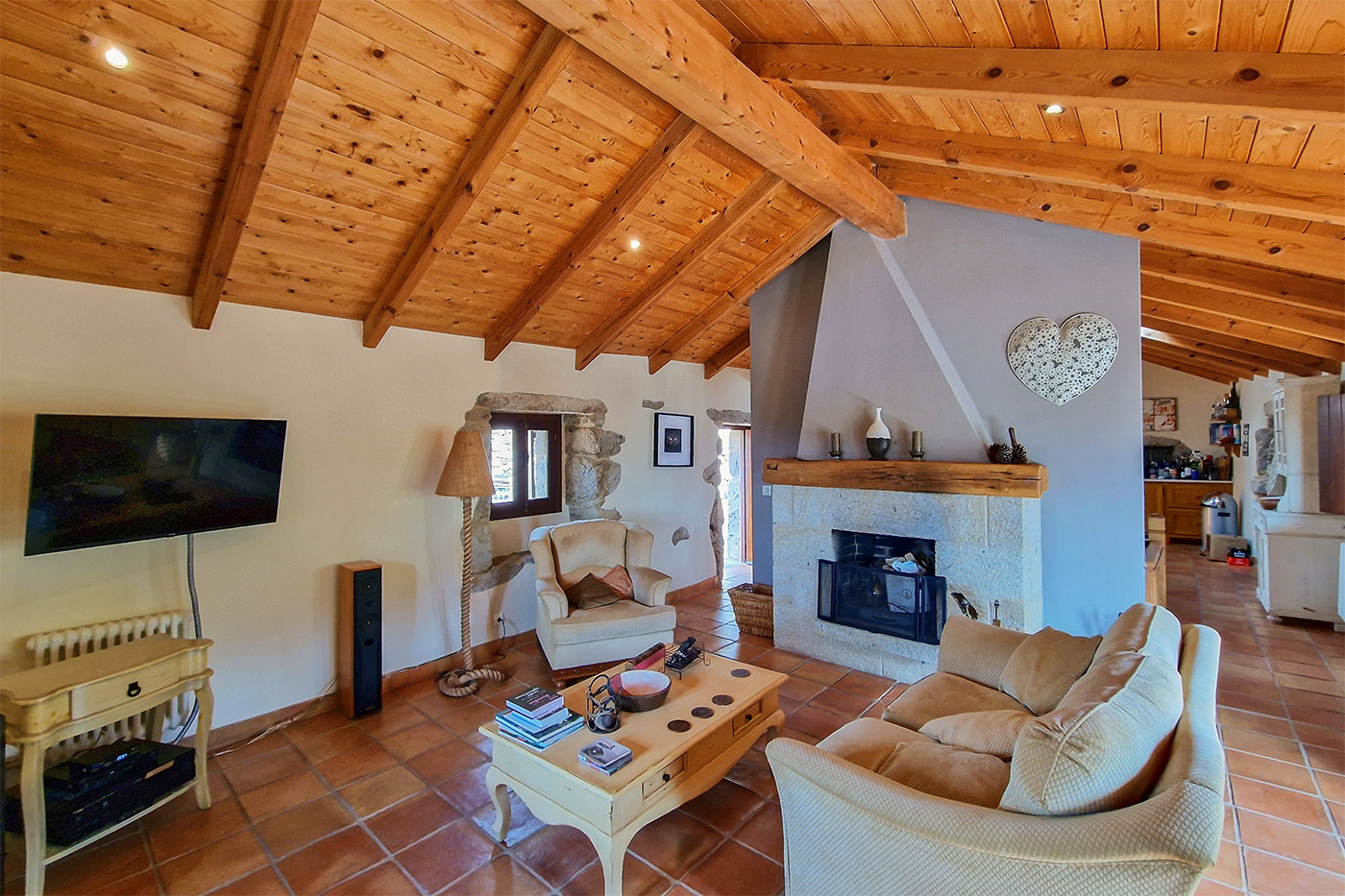 Pleasant lounge with log fire connects to the kitchen-dining area