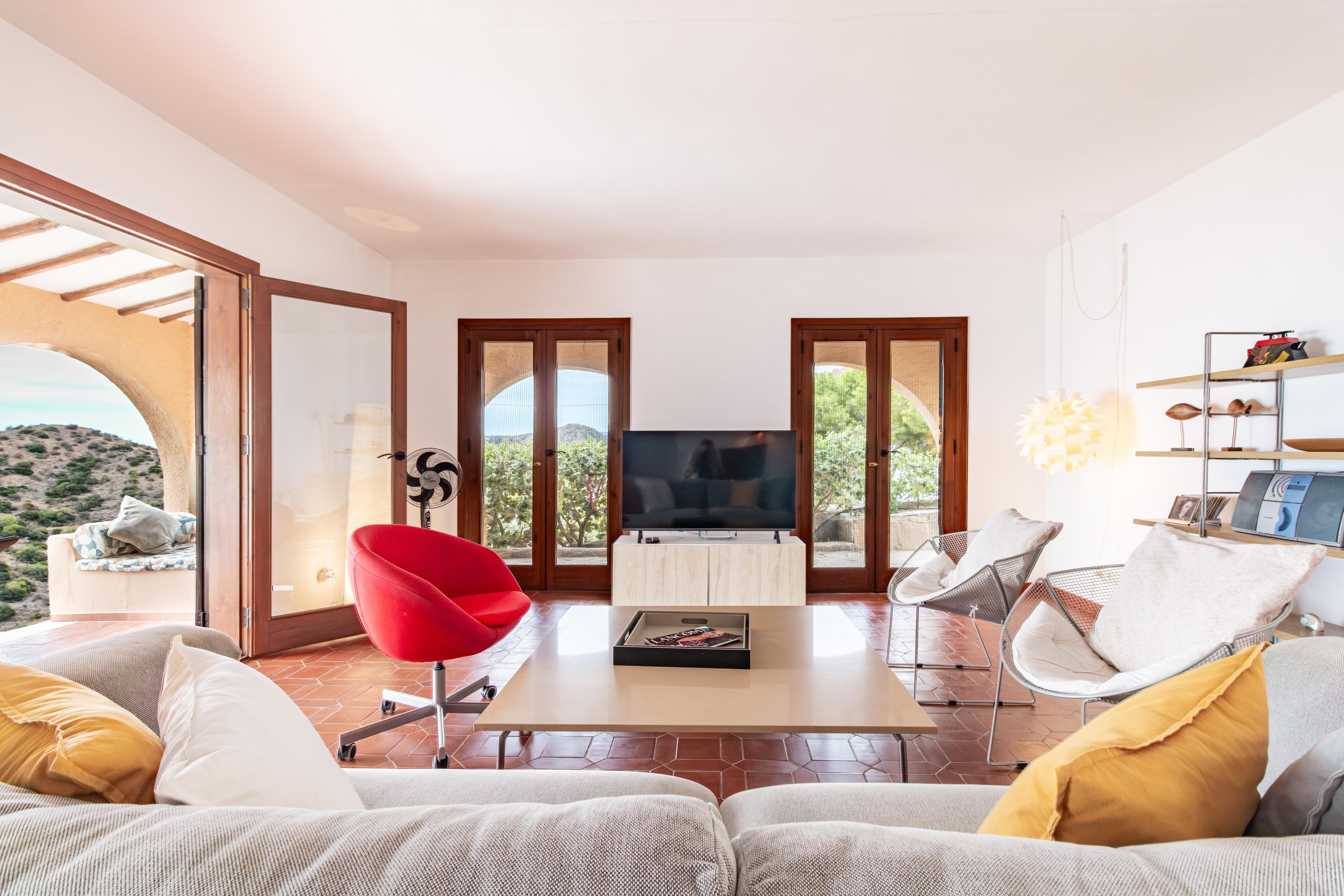 Living areas are bright with doors to terraces
