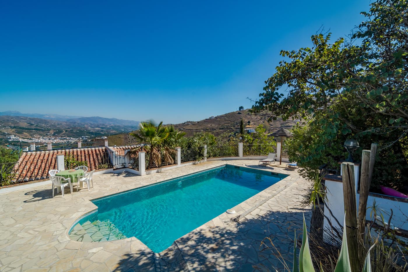 The D shape pool is above the house