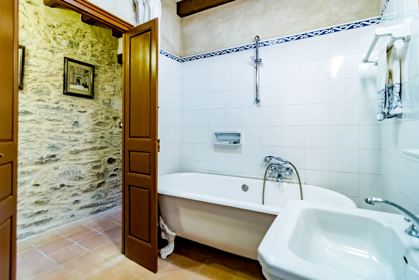 Bathroom with old tub and shower over
