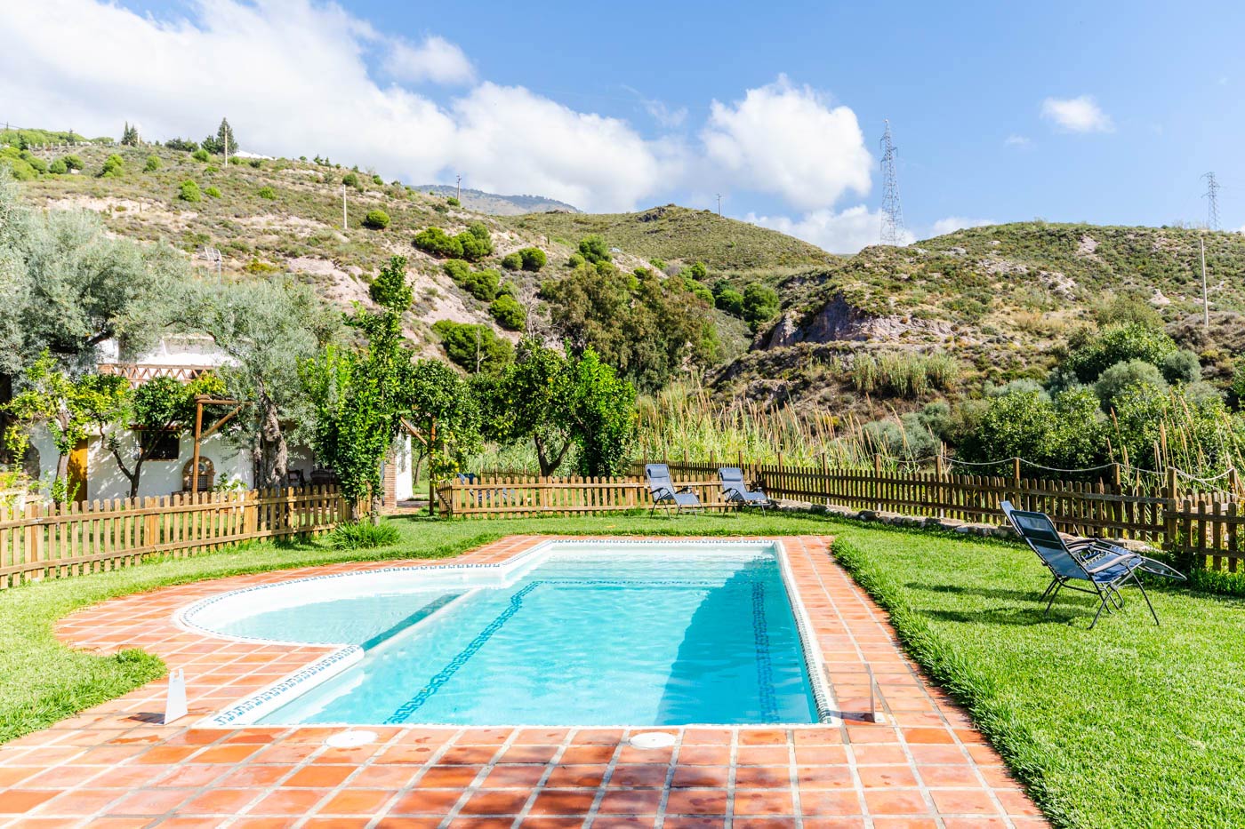 The pool area is fenced