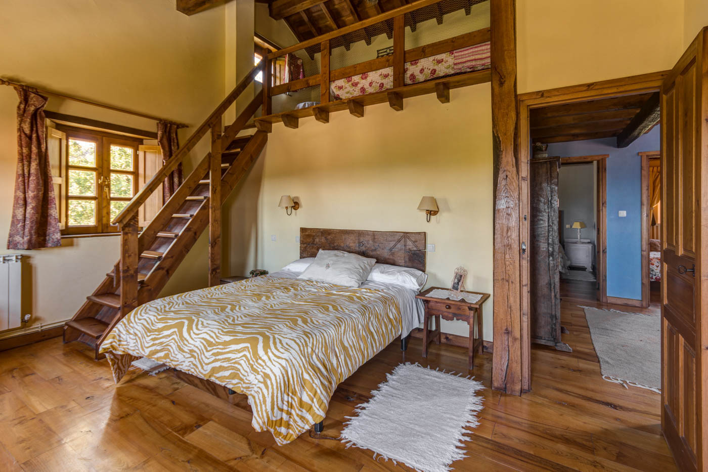 Double bedded room with a gallery room