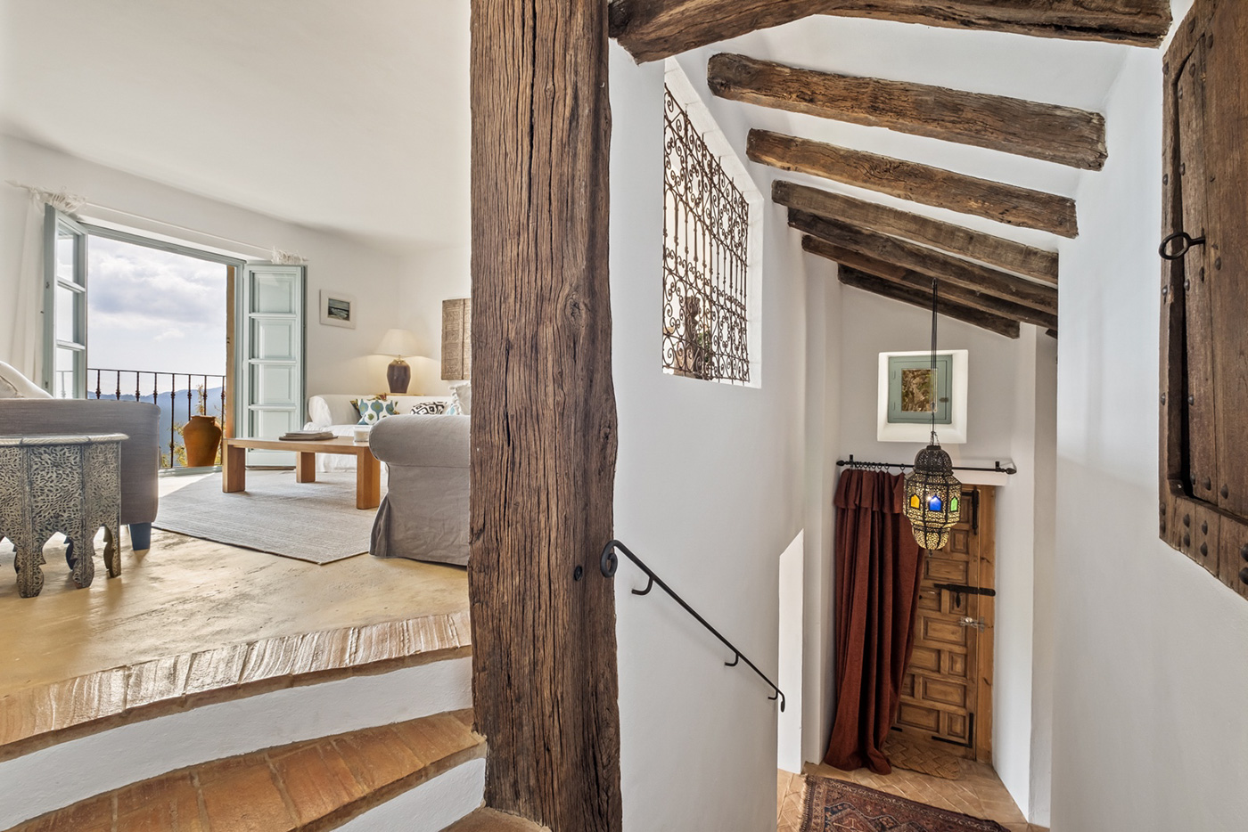 A fews steps to louge and stairs to lower floor