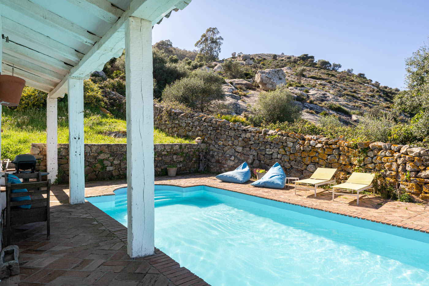 There is only rocky countryside at the back of the house