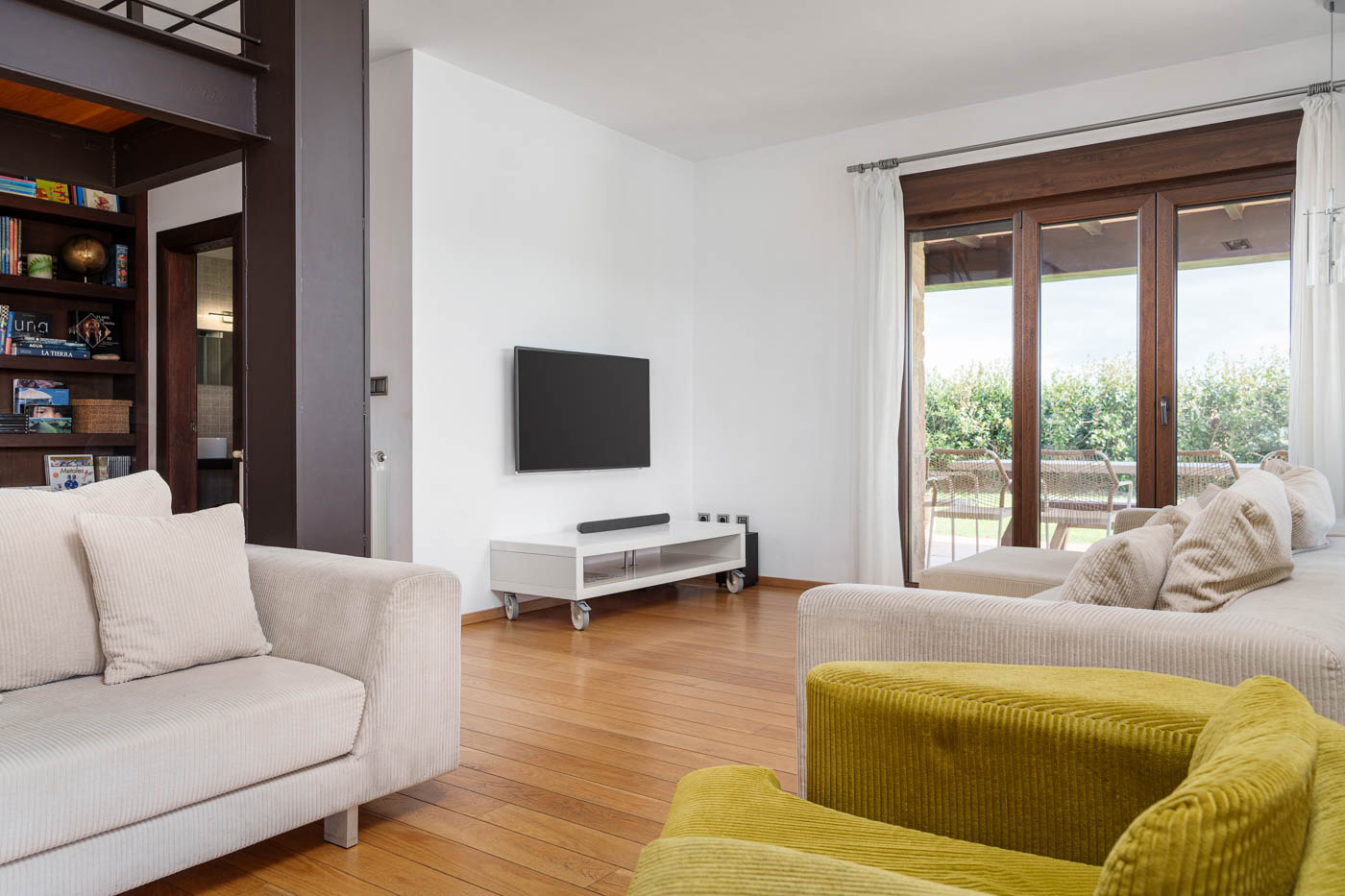 Living area with doors to furnished porch