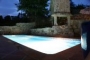 The pool illuminated by night