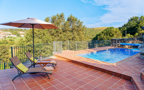 Heated swimming pool and sun loungers