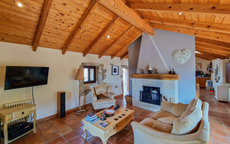 Pleasant lounge with log fire connects to the kitchen-dining area