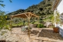 Patio terrace and hillside rising behind