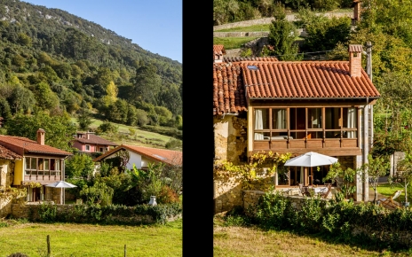 The house seen from beyond fields by the property