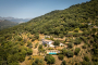 Your villa seen from a distance, with Ronda mountains at the back