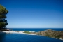 The pool curves towards the sea, it is all open.