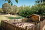 The Wendy house has sand and its own fence