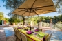 Outdoor table conveniently located next to kitchen