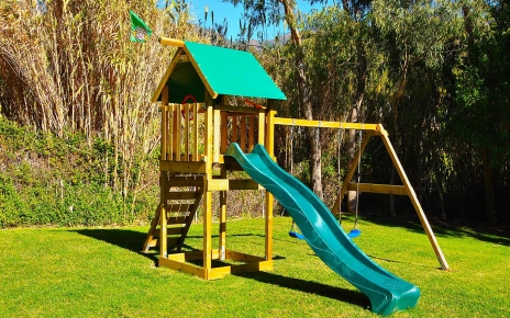 Swing and slide in children area