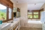 En suite bathroom with bath and walk-in shower