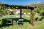 Shaded pool area with mountain views