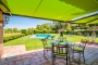 Awnings by pool house
