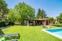 Pool / barbecue house with holiday home behind on the right
