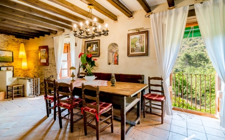 Dining space with balconies overlooking house gardens