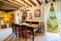 Dining space with balconies overlooking house gardens