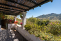 Shaded terrace by the entrance to the villa