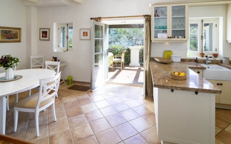 Kitchen / dining area with doors to shaded terrace