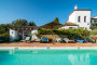 Pool area and villa