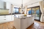 Kitchen with sliding door opening to terrace 