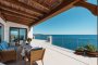Furnished pergola next to indoor living/dining area