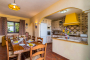 Indoor dining table next to kitchen