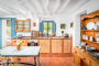 Kitchen with doors to furnished terraces