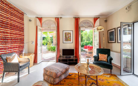 Apartment living area with doors opening to terraces