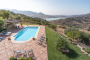 Pool and gardens with Zahara reservoir as backdrop