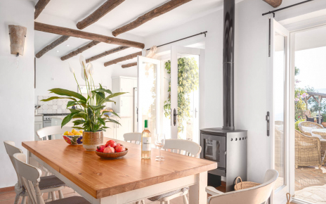 Dining room / kitchen with doors opening to terraces