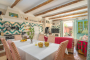 Open plan kitchen / seating area with doors to terrace