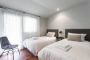 Twin bedded room with access to terrace