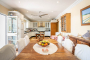 Open plan kitchen / dining with doors to terraces