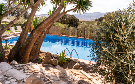 Steps down to pool from villa terraces