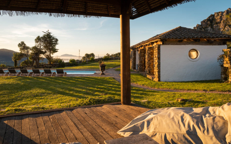 Views to pool and porch with Morocco as backdrop