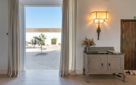 The kitchen and dining area is across the patio