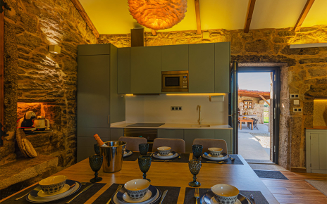 The kitchen is close to the barbecue are which is handy