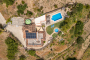 Villa, pool and gardens seen from a drone