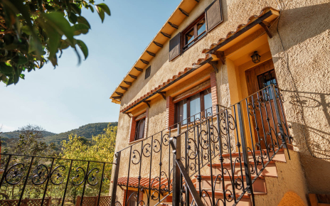 Front of the house with stairs to two bedrooms