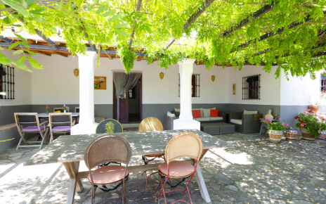 Front furnished patio with pergola